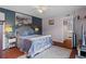 Relaxing main bedroom with wood floors, stylish decor, and an ensuite bathroom at 2612 6Th Ct, Palm Harbor, FL 34684