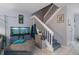 Cozy staircase next to the living area with gray stairs and a white banister at 2612 6Th Ct, Palm Harbor, FL 34684