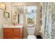 The bathroom features a vanity, toilet, and decorative window treatments at 2824 Conch Hollow Dr, Brandon, FL 33511
