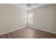Bedroom with hardwood floors, neutral walls, ceiling fan and window at 2824 Conch Hollow Dr, Brandon, FL 33511