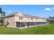 Beautiful townhomes with screened patios, well-maintained lawn, and beige exteriors offers great community living at 2824 Conch Hollow Dr, Brandon, FL 33511