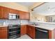Well-equipped kitchen with stainless steel appliances, stylish backsplash, and ample counter space at 2824 Conch Hollow Dr, Brandon, FL 33511