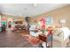Open-concept living room with wood flooring, stylish decor, and access to the dining area and kitchen at 2824 Conch Hollow Dr, Brandon, FL 33511