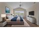 Spacious main bedroom with vaulted ceiling, sitting area, ceiling fan and carpet floors at 2824 Conch Hollow Dr, Brandon, FL 33511
