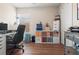 Office space features a large desk, rolling chair, and organized storage for a productive workspace at 2824 Conch Hollow Dr, Brandon, FL 33511