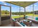 Relaxing screened patio with comfortable seating and scenic views of the lake, ideal for outdoor living at 2824 Conch Hollow Dr, Brandon, FL 33511