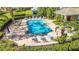 A beautiful swimming pool is surrounded by lush landscaping and plenty of lounge seating for residents at 2824 Conch Hollow Dr, Brandon, FL 33511