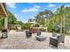 Expansive backyard features a barbecue grill, fire pit, pool, and dining area for outdoor entertainment at 3018 N 164Th Pl, Clearwater, FL 33760