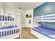 Bedroom featuring multiple bunkbeds and a modern design, with access to a private outdoor space at 3018 N 164Th Pl, Clearwater, FL 33760