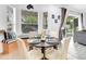 Eat-in kitchen with a modern dining set, a window seat, and a view to the backyard and outdoor patio at 3018 N 164Th Pl, Clearwater, FL 33760