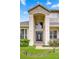 Inviting front entrance with a covered porch, manicured landscaping, and updated features at 3018 N 164Th Pl, Clearwater, FL 33760