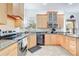 Well-equipped kitchen with stainless steel appliances, granite countertops, and ample cabinet space at 3018 N 164Th Pl, Clearwater, FL 33760