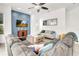 Comfortable living room with a large sectional sofa, a blue accent wall, and a mounted TV at 3018 N 164Th Pl, Clearwater, FL 33760