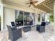 Inviting covered patio with comfortable seating, perfect for outdoor relaxation and entertaining guests at 3018 N 164Th Pl, Clearwater, FL 33760