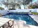 A sparkling in-ground pool is perfect for cooling off on those hot summer days at 3247 Macintosh Rd, Land O Lakes, FL 34639