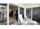 Relaxing balcony with comfortable seating, a peek of ocean view, and access to the interior living space at 3400 Gulf Blvd # 304, Belleair Beach, FL 33786