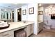 Bright bathroom featuring a vanity with cabinet storage and a separate toilet room at 3400 Gulf Blvd # 304, Belleair Beach, FL 33786