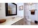 Clean bathroom featuring vanity with ample lighting, modern fixtures, and neutral decor at 3400 Gulf Blvd # 304, Belleair Beach, FL 33786