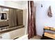 Bathroom with a luxurious tub, shower, and vanity with warm lighting and tile flooring at 3400 Gulf Blvd # 304, Belleair Beach, FL 33786
