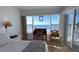Cozy bedroom with ocean view and quaint furniture at 3400 Gulf Blvd # 304, Belleair Beach, FL 33786
