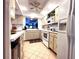 Charming kitchen featuring recessed lights, ceiling fan, tile floors and updated appliances at 3400 Gulf Blvd # 304, Belleair Beach, FL 33786