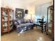 Bright living room with carpet, display cabinets, and a comfortable sofa at 3400 Gulf Blvd # 304, Belleair Beach, FL 33786