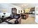 Warm and inviting living room with a wooden table and leather sofa at 3400 Gulf Blvd # 304, Belleair Beach, FL 33786
