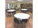 Well-lit space filled with tables and chairs, bookshelves stocked with books for community members at 34156 Juniper N Dr, Pinellas Park, FL 33781