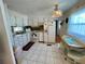 Bright kitchen with tile floors and ample cabinet space at 34156 Juniper N Dr, Pinellas Park, FL 33781