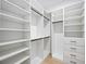 Well-organized walk-in closet with shelving, drawers, and hanging space to maximize storage at 3601 W Platt St, Tampa, FL 33609