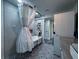 This bathroom features a modern washer/dryer and decorative tile at 38055 Avion Dr, Zephyrhills, FL 33542