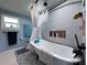 This bathroom features a soaking tub with shower and decorative tile at 38055 Avion Dr, Zephyrhills, FL 33542