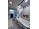 This bathroom features a soaking tub with shower and decorative tile at 38055 Avion Dr, Zephyrhills, FL 33542