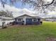 Cozy home featuring painted cinder block and white trim at 38055 Avion Dr, Zephyrhills, FL 33542