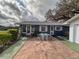 Home with a brick walkway at 38055 Avion Dr, Zephyrhills, FL 33542