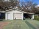 Garage with a one-car carport at 38055 Avion Dr, Zephyrhills, FL 33542