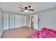 Bedroom featuring multiple closets and ceiling fan at 415 Maplewood Cir, Oldsmar, FL 34677