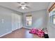 Bright bedroom with wood floors and a built-in closet at 415 Maplewood Cir, Oldsmar, FL 34677