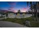 Charming home with picket fence, mature landscaping, and inviting curb appeal at 415 Maplewood Cir, Oldsmar, FL 34677