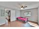 Bright living room with ceiling fan and window at 415 Maplewood Cir, Oldsmar, FL 34677