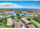 Panoramic aerial view of waterfront homes, canals, and community near the ocean under blue sky at 4570 Overlook Ne Dr # 282, St Petersburg, FL 33703