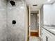 Modern bathroom features a walk-in shower with elegant tilework and updated fixtures at 4570 Overlook Ne Dr # 282, St Petersburg, FL 33703
