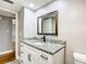 Bathroom featuring a granite countertop, modern sink and faucet, and white cabinets at 4570 Overlook Ne Dr # 282, St Petersburg, FL 33703