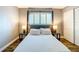 Comfortable bedroom features a plush bed, matching nightstands, and modern lamps at 4570 Overlook Ne Dr # 282, St Petersburg, FL 33703