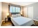 Well-lit bedroom with a bed, side tables, and closet at 4570 Overlook Ne Dr # 282, St Petersburg, FL 33703