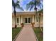 Welcoming clubhouse entrance with manicured landscaping and inviting double doors at 4570 Overlook Ne Dr # 282, St Petersburg, FL 33703