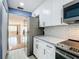 Well-lit kitchen featuring stainless steel appliances, granite countertops, and ample cabinet space at 4570 Overlook Ne Dr # 282, St Petersburg, FL 33703