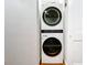 A view of modern stacked washer and dryer in a bright laundry space at 4570 Overlook Ne Dr # 282, St Petersburg, FL 33703