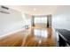 Bright living room with wood floors, grey walls, and a large window with great natural light at 4570 Overlook Ne Dr # 282, St Petersburg, FL 33703