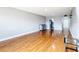 The living room features wood floors, grey walls, with hallway, and entrance to kitchen at 4570 Overlook Ne Dr # 282, St Petersburg, FL 33703